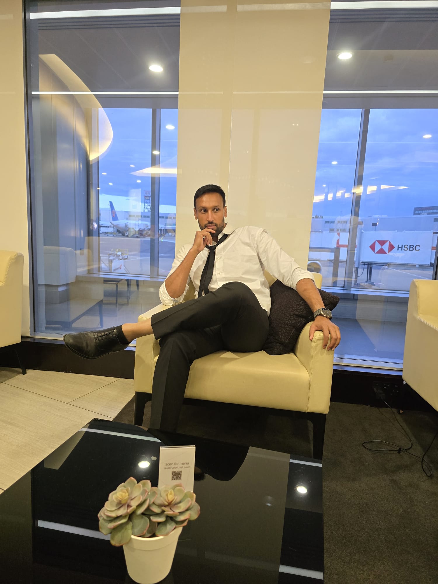 Faheem Ahmed seated in an airport lounge
